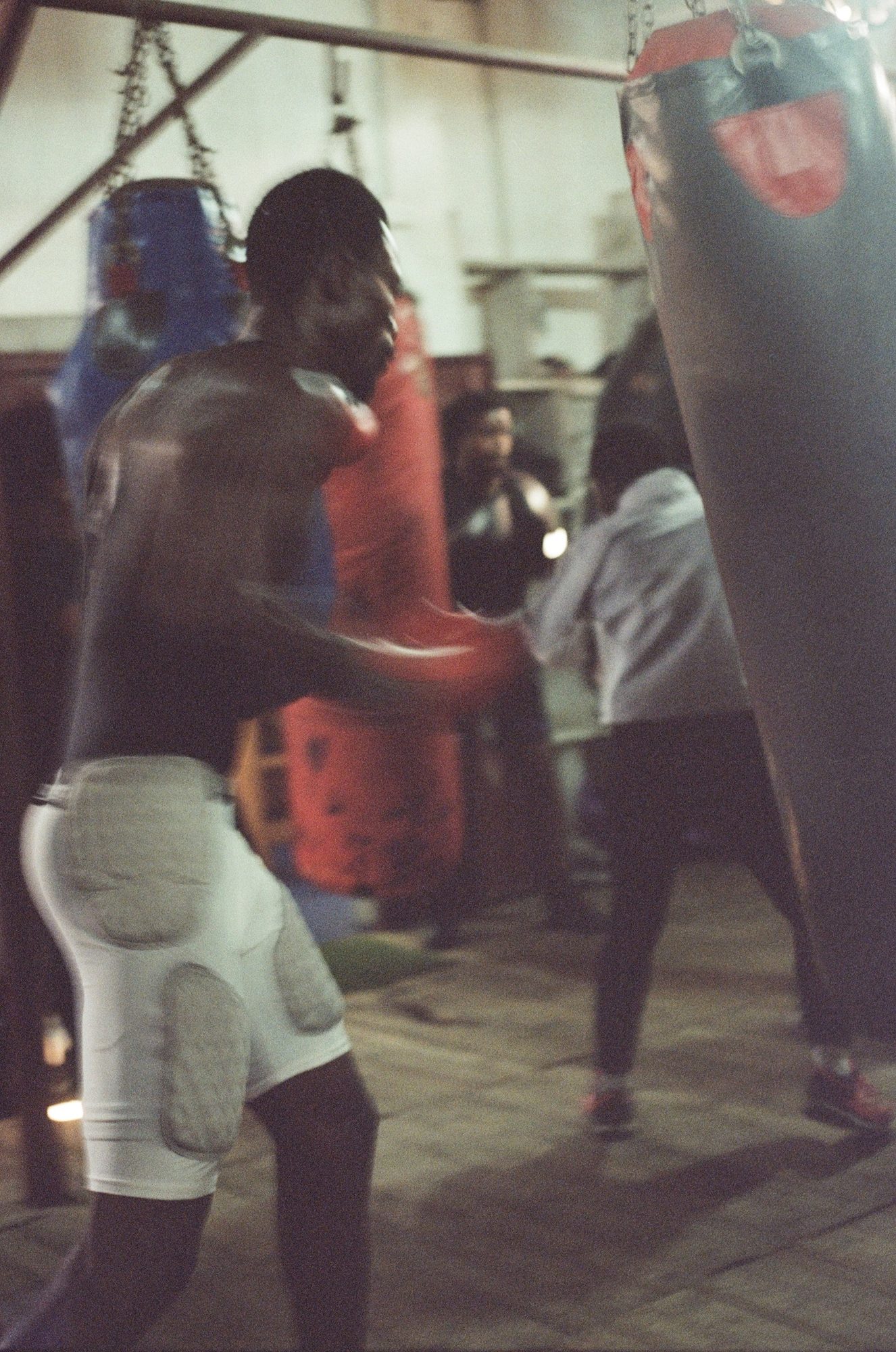 Bag work under the lights. Film photograph by Ludovic Nkoth