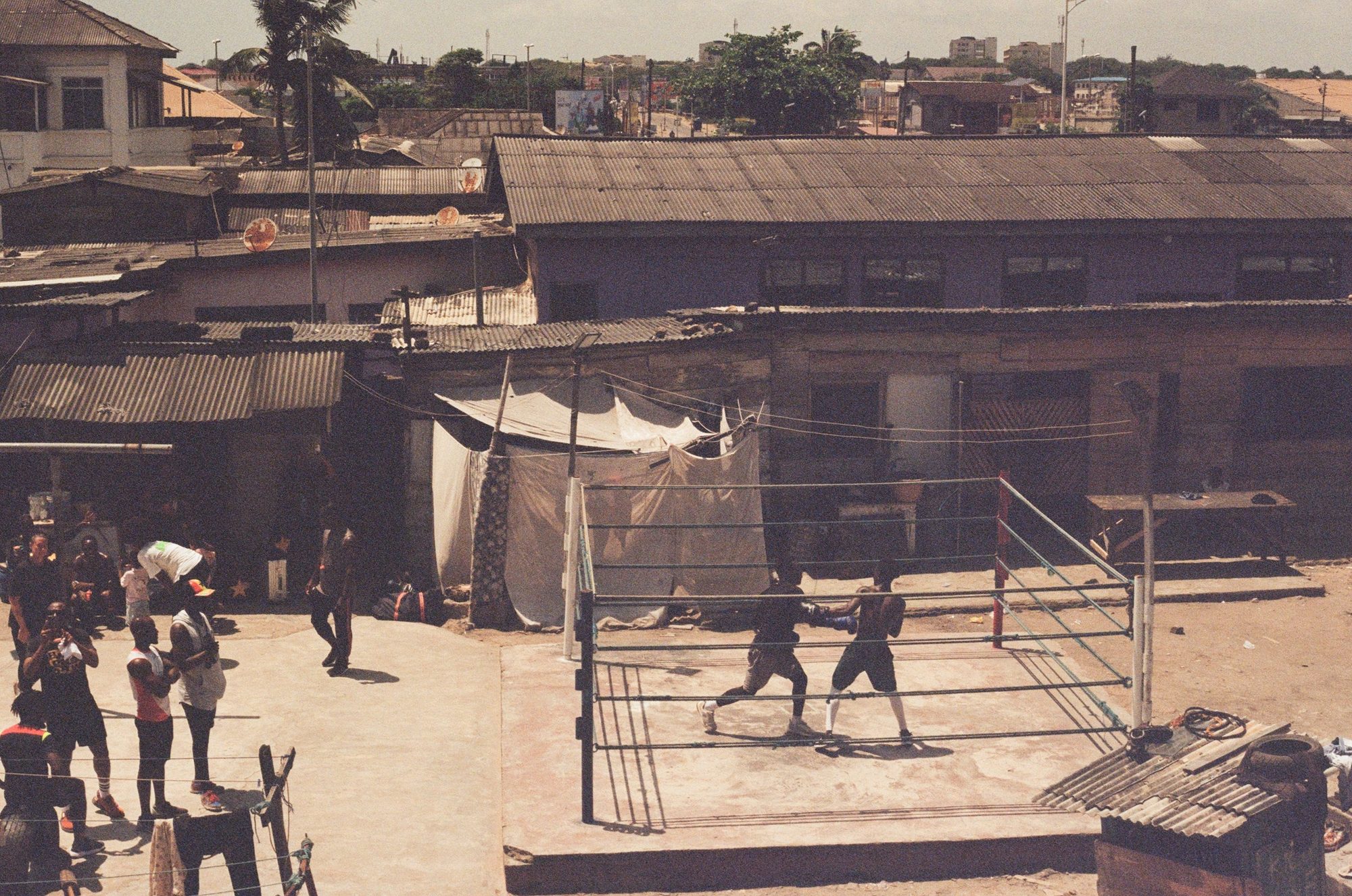 Rooftop ring above the city, Accra. Film photograph by Ludovic Nkoth