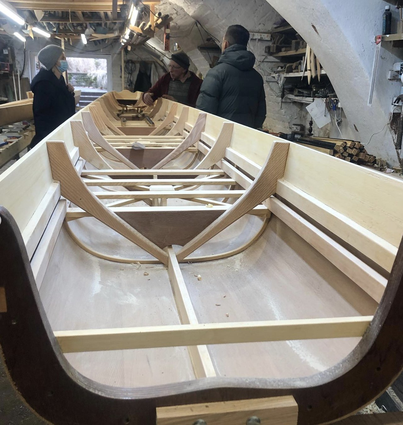 One of the 12 bespoke boats taking shape by hand in the workshop in Richmond