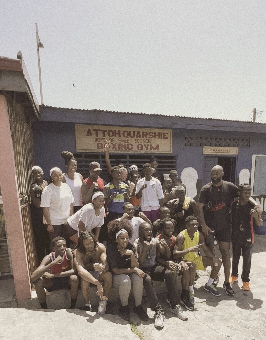 The group with fighters outside Attoh Quarshie Boxing Gym