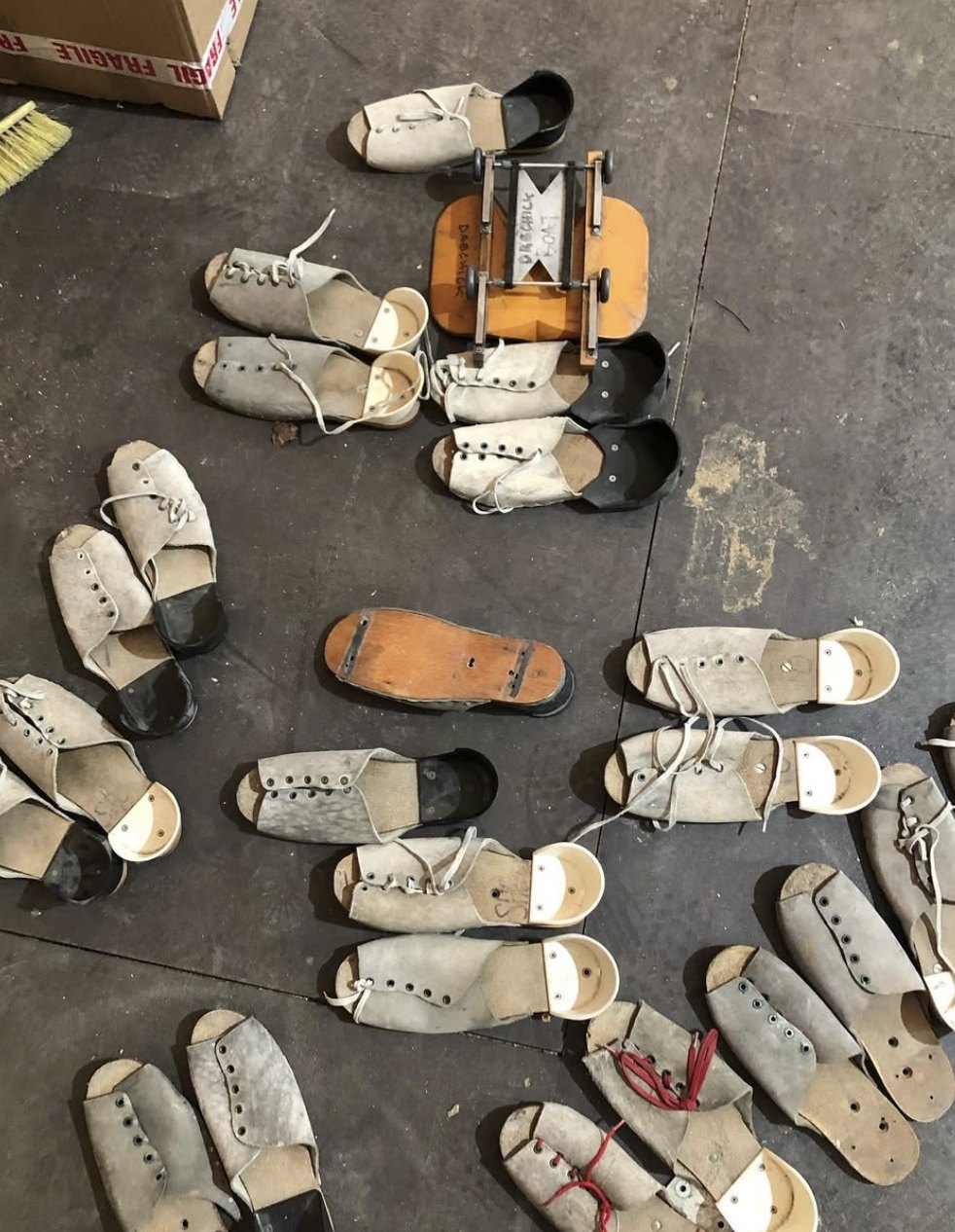 Period rowing shoes and a sliding seat, restored for the picture boats